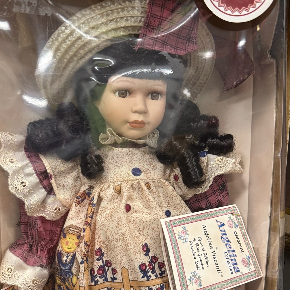 Angelina Porcelain Doll with Black Hair and Cream Dress